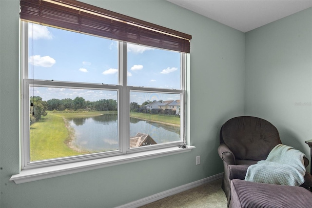 646 Marsh Reed Dr, Winter Garden, FL 34787 - sitting room featuring carpet floors and a water view