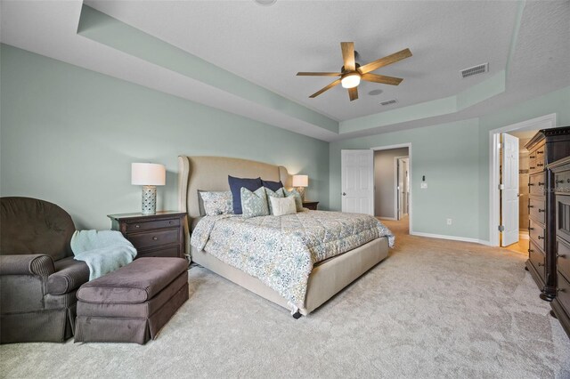 646 Marsh Reed Dr, Winter Garden, FL 34787 - carpeted bedroom with a tray ceiling and ceiling fan