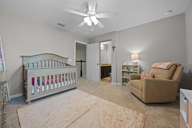 646 Marsh Reed Dr, Winter Garden, FL 34787 - bedroom with carpet, ceiling fan, a nursery area, and connected bathroom