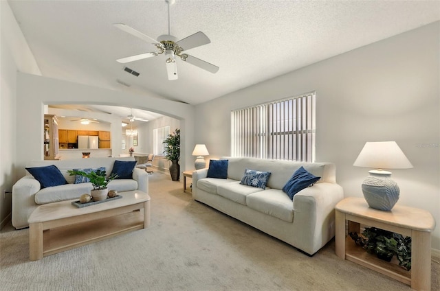 1548 Challenger Ave, Davenport, FL 33897 - living area with ceiling fan, light carpet, lofted ceiling, and arched walkways
