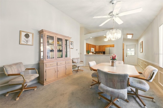1548 Challenger Ave, Davenport, FL 33897 - dining room featuring a chandelier, light colored carpet, vaulted ceiling, and ceiling fan