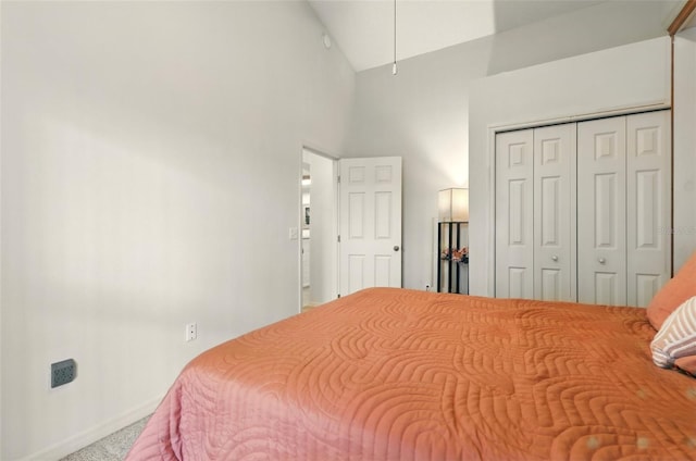 1548 Challenger Ave, Davenport, FL 33897 - carpeted bedroom with high vaulted ceiling, a closet, baseboards, and attic access