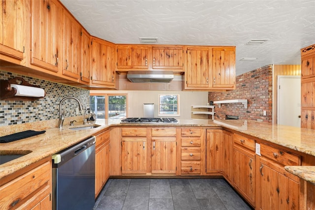 106 8th St, Lake Hamilton, FL 33851 - kitchen with dishwashing machine, a sink, under cabinet range hood, backsplash, and light stone countertops