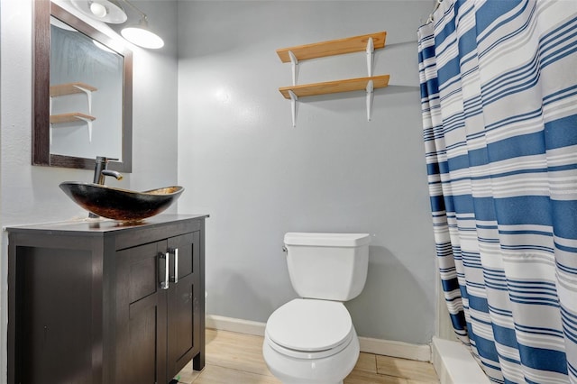106 8th St, Lake Hamilton, FL 33851 - bathroom featuring vanity, baseboards, toilet, and wood finished floors