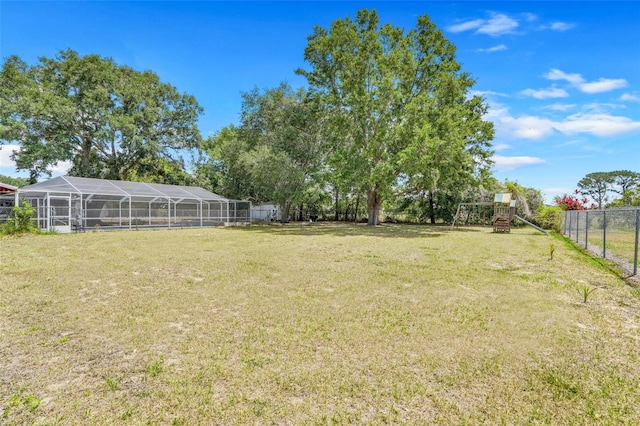 106 8th St, Lake Hamilton, FL 33851 - view of yard with a lanai and a detached carport