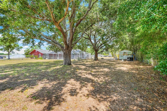 106 8th St, Lake Hamilton, FL 33851 - view of yard with fence and an outdoor structure
