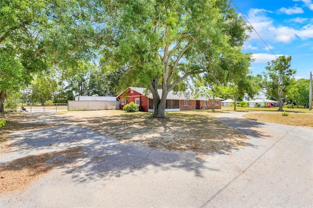106 8th St, Lake Hamilton, FL 33851 - ranch-style home featuring driveway and fence