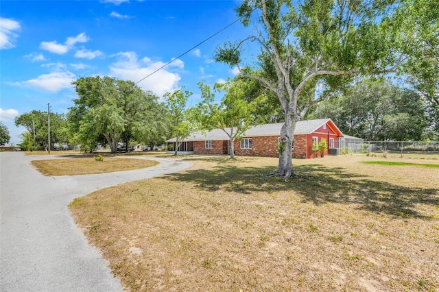 106 8th St, Lake Hamilton, FL 33851 - ranch-style home with brick siding and driveway