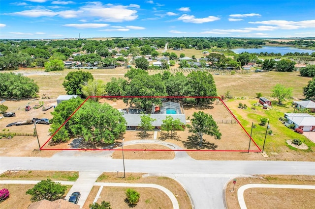 106 8th St, Lake Hamilton, FL 33851 - aerial overview of property's location featuring property boundaries highlighted, a nearby body of water, and a tree filled landscape