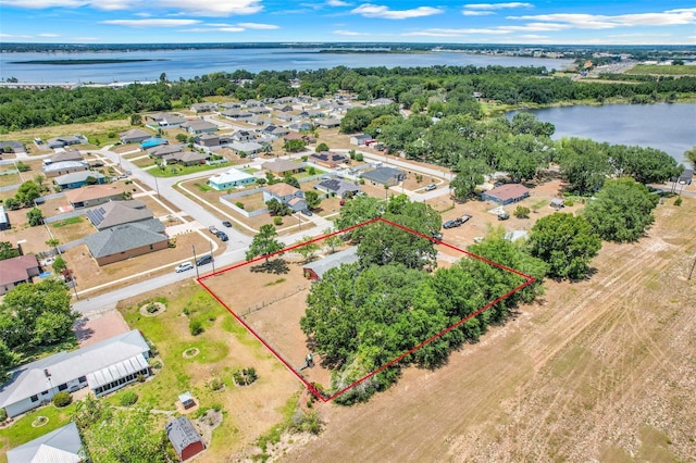 106 8th St, Lake Hamilton, FL 33851 - aerial perspective of suburban area featuring property parcel outlined and a nearby body of water