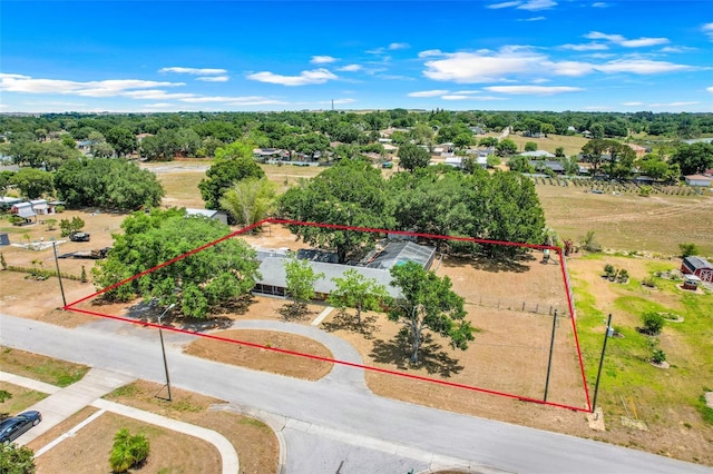 106 8th St, Lake Hamilton, FL 33851 - aerial view of property and surrounding area featuring property boundaries highlighted and a tree filled landscape
