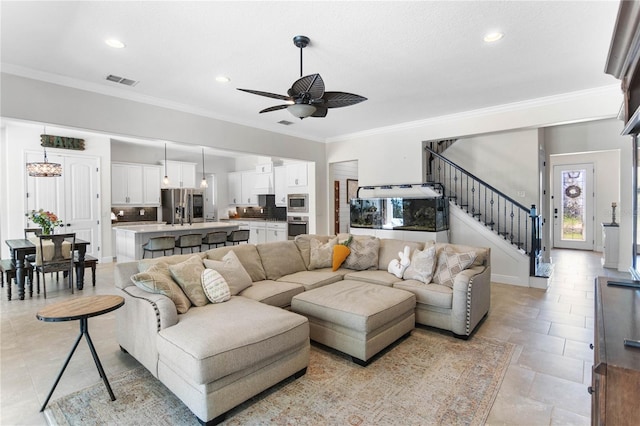 557 Lake Cove Pointe Cir, Winter Garden, FL 34787 - living room with a ceiling fan, stairway, ornamental molding, and recessed lighting