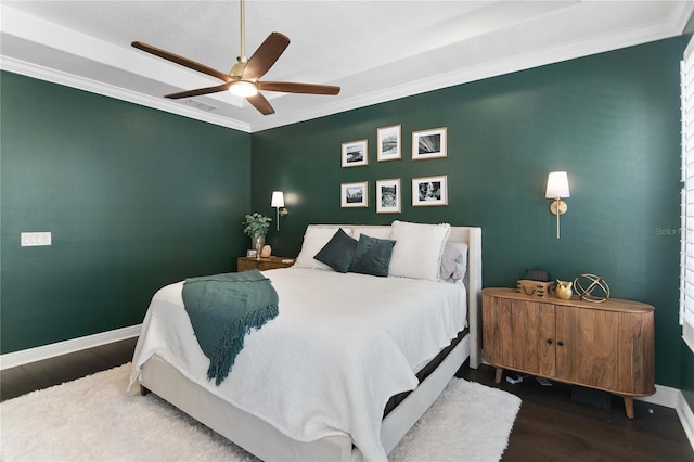 557 Lake Cove Pointe Cir, Winter Garden, FL 34787 - bedroom with crown molding, wood finished floors, baseboards, and ceiling fan