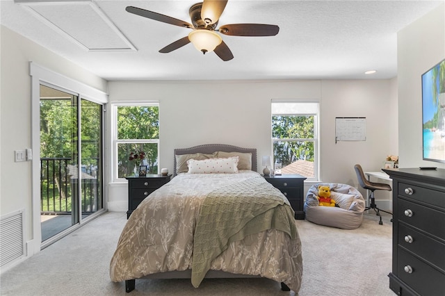557 Lake Cove Pointe Cir, Winter Garden, FL 34787 - bedroom featuring carpet, access to outside, multiple windows, and a ceiling fan