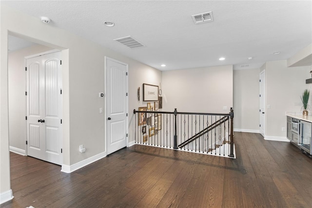 557 Lake Cove Pointe Cir, Winter Garden, FL 34787 - corridor featuring an upstairs landing, wood finished floors, baseboards, and recessed lighting