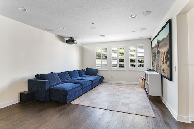 557 Lake Cove Pointe Cir, Winter Garden, FL 34787 - living area with wood finished floors, baseboards, a textured ceiling, and recessed lighting
