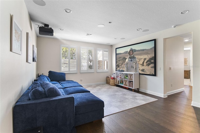 557 Lake Cove Pointe Cir, Winter Garden, FL 34787 - living room with wood finished floors, a textured ceiling, baseboards, and recessed lighting