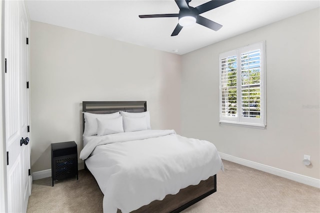 557 Lake Cove Pointe Cir, Winter Garden, FL 34787 - carpeted bedroom featuring baseboards and ceiling fan