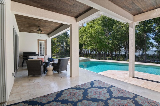 557 Lake Cove Pointe Cir, Winter Garden, FL 34787 - view of swimming pool featuring a ceiling fan, a patio, an outdoor living space, and a pool with connected hot tub