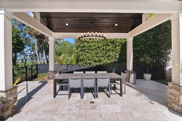 557 Lake Cove Pointe Cir, Winter Garden, FL 34787 - fenced backyard with a patio and outdoor dining area