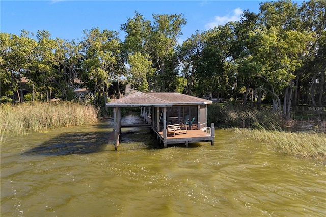 557 Lake Cove Pointe Cir, Winter Garden, FL 34787 - dock featuring boat lift, a water view, and view of scattered trees