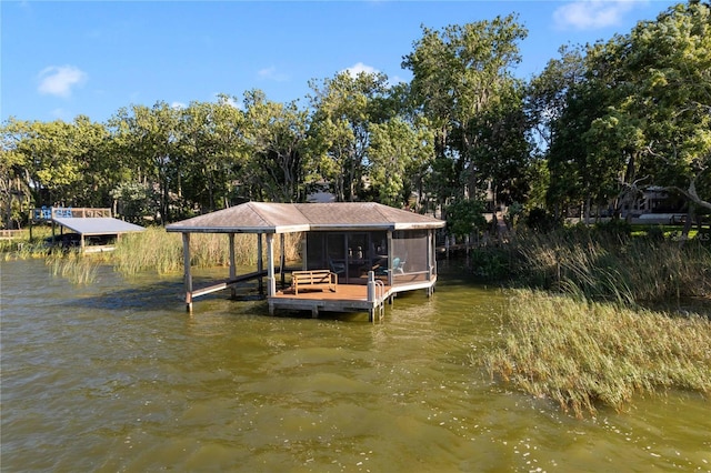 557 Lake Cove Pointe Cir, Winter Garden, FL 34787 - dock with boat lift, a water view, and view of wooded area
