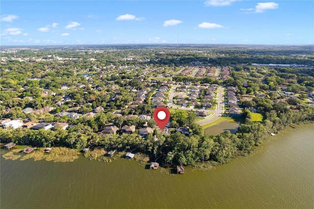 557 Lake Cove Pointe Cir, Winter Garden, FL 34787 - aerial view of property and surrounding area with a large body of water, nearby suburban area, and a tree filled landscape