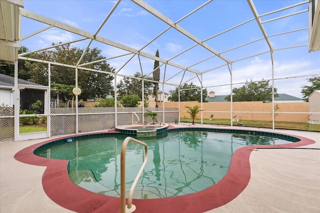 view of swimming pool featuring fence, a patio area, a lanai, and a pool with connected hot tub