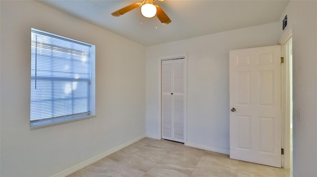 326 Hobart Ave, Daytona Beach, FL 32114 - unfurnished bedroom featuring a closet, baseboards, and a ceiling fan