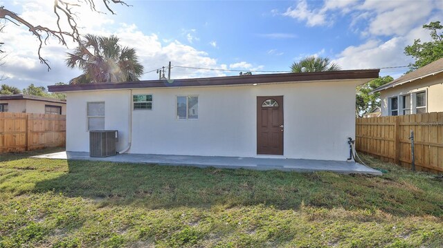 326 Hobart Ave, Daytona Beach, FL 32114 - back of house featuring stucco siding and central AC