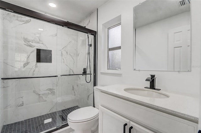 3100 Las Palmas Dr, Titusville, FL 32780 - bathroom with toilet, vanity, a marble finish shower, and recessed lighting