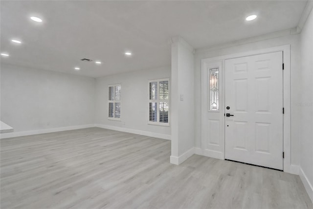 3100 Las Palmas Dr, Titusville, FL 32780 - foyer featuring light wood-style flooring, baseboards, and recessed lighting