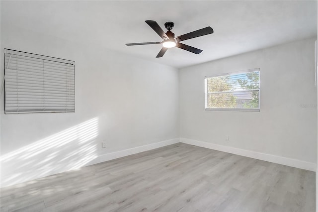 3100 Las Palmas Dr, Titusville, FL 32780 - spare room featuring light wood finished floors, baseboards, and ceiling fan
