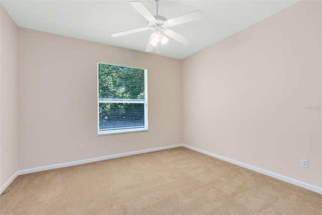 9330 Shadow Pinar Ct, Orlando, FL 32825 - empty room with light carpet, baseboards, and a ceiling fan