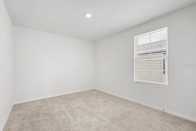 3039 Meleto Blvd, New Smyrna Beach, FL 32168 - carpeted empty room with baseboards