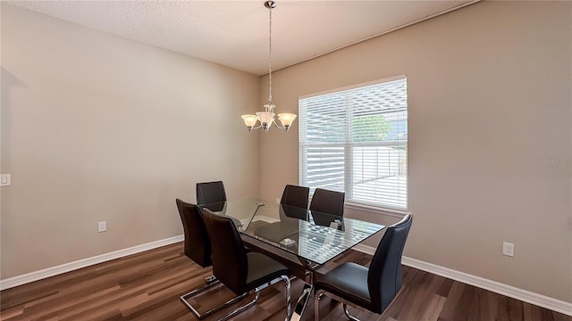 9917 Summerlake Groves St, Winter Garden, FL 34787 - dining room featuring baseboards, dark wood-style floors, and a chandelier