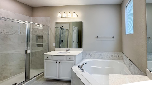 9917 Summerlake Groves St, Winter Garden, FL 34787 - bathroom featuring a shower stall, a garden tub, and vanity