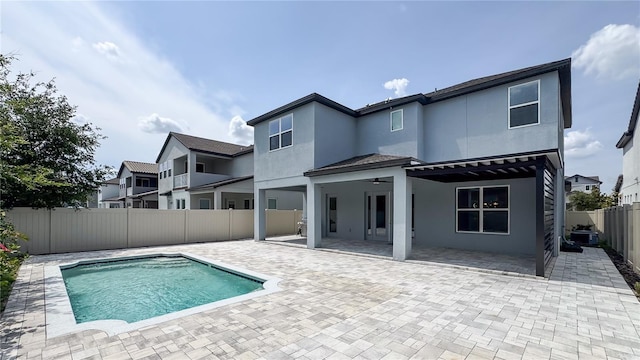 9917 Summerlake Groves St, Winter Garden, FL 34787 - rear view of house with stucco siding, a fenced backyard, a patio, and a ceiling fan