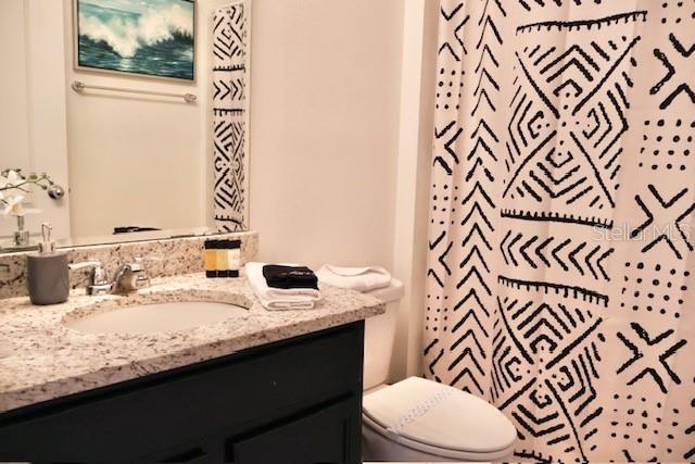 bathroom with vanity and toilet
