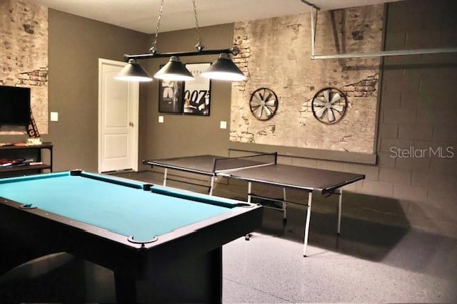 game room featuring speckle patterned floor and billiards table