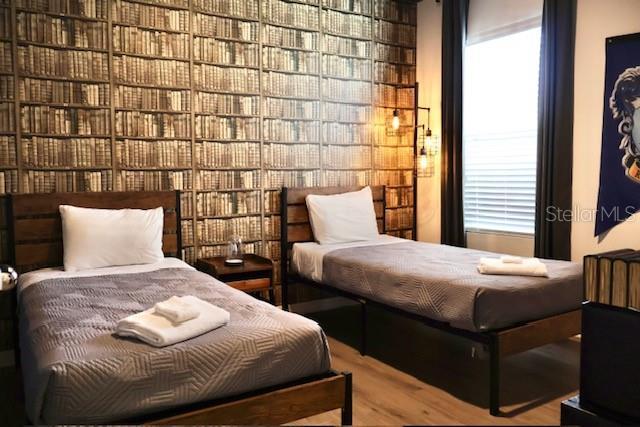bedroom featuring wood finished floors