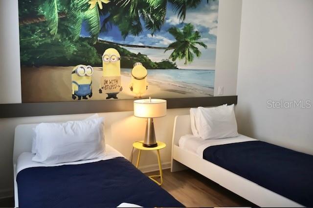 bedroom with wood finished floors
