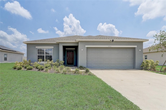 view of front of house featuring stucco siding, an attached garage, concrete driveway, and a front yard