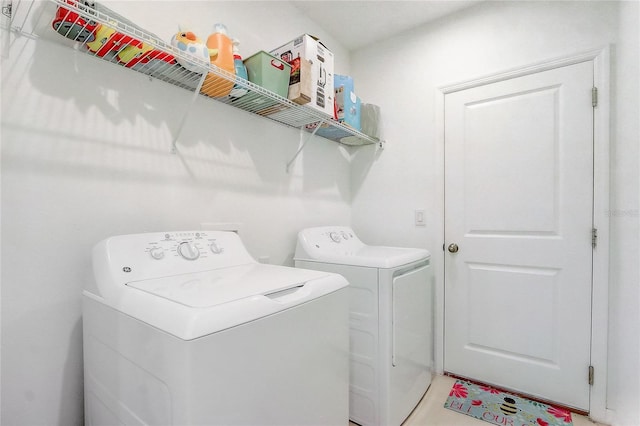 clothes washing area featuring washing machine and clothes dryer