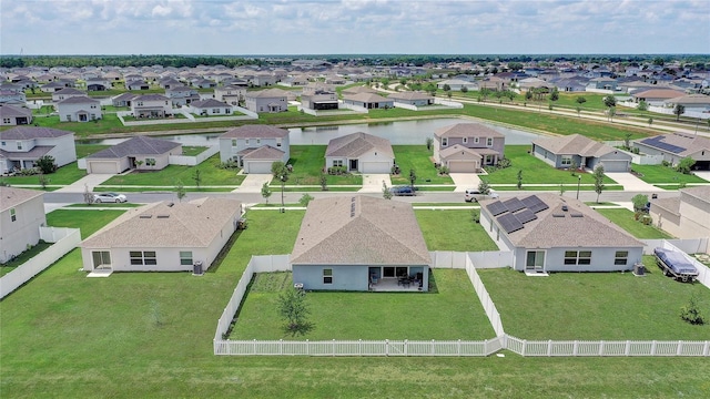 aerial perspective of suburban area with a nearby body of water