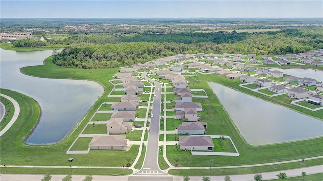 aerial view of residential area with a nearby body of water
