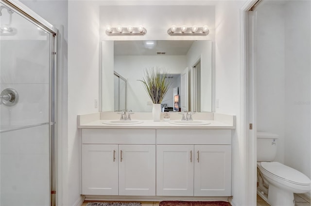 392 Citrine Loop, Kissimmee, FL 34758 - bathroom with double vanity and an enclosed shower