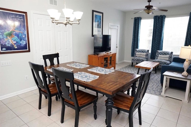 2785 Almaton Loop Unit 204, Kissimmee, FL 34747 - dining room featuring a chandelier, ceiling fan, baseboards, and light tile patterned floors