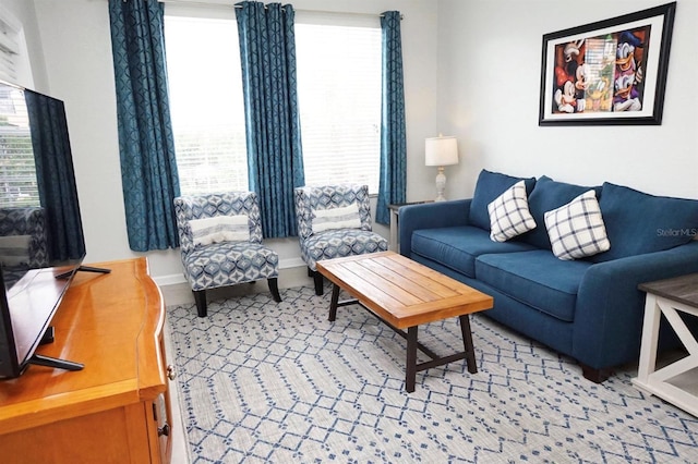 2785 Almaton Loop Unit 204, Kissimmee, FL 34747 - living room featuring healthy amount of natural light and baseboards