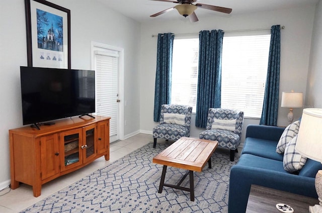 2785 Almaton Loop Unit 204, Kissimmee, FL 34747 - living area with a ceiling fan, baseboards, and light tile patterned floors